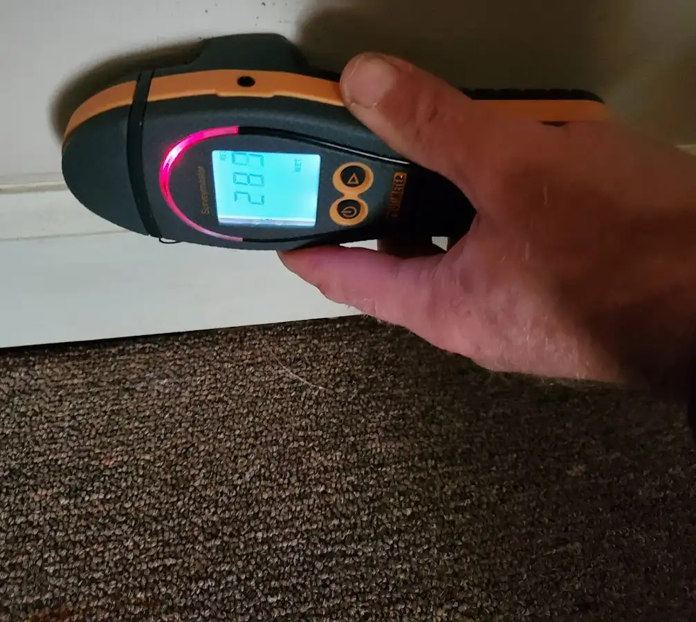Moisture detection at baseboard during Storm Damage Restoration in New Ipswich